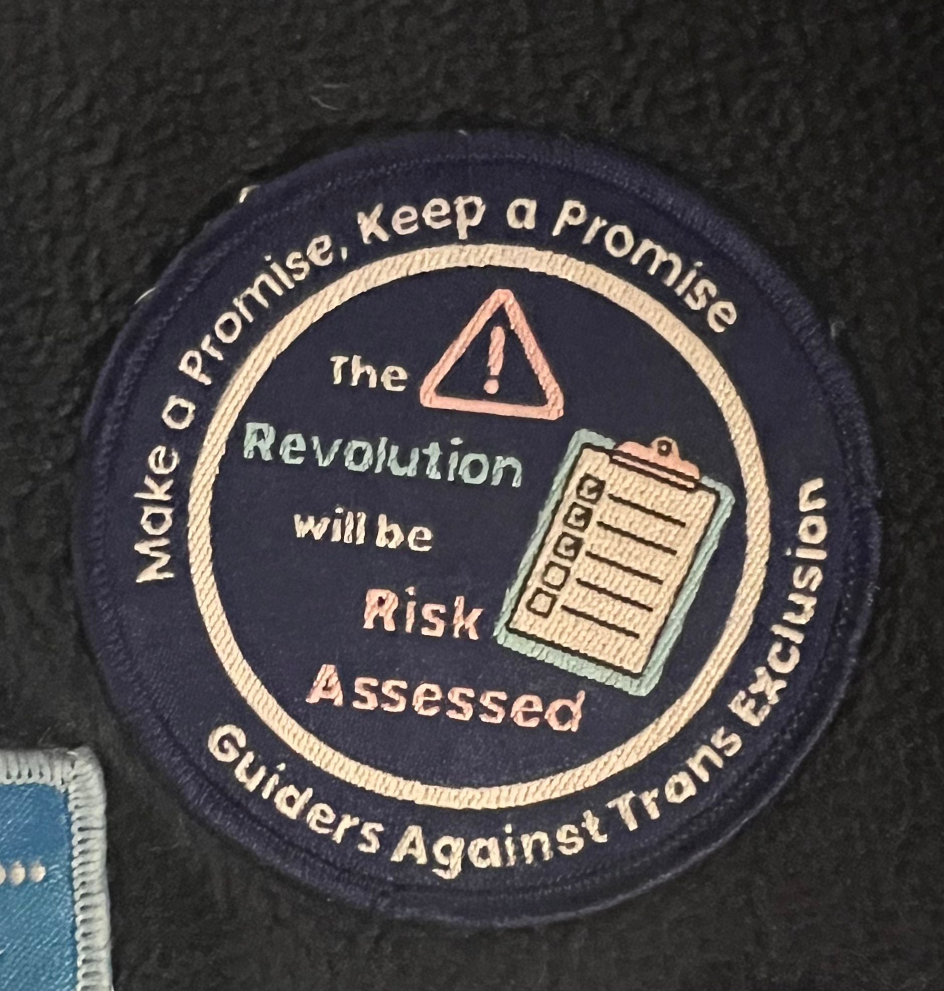 'The Revolution will be Risk Assessed' woven badge